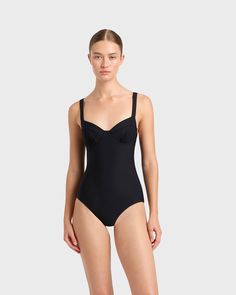 A modern classic, the Loures balconette one piece in black is cut from our luxury, Italian Sculpteur® fabric with patented 3-D stretch technology that flatters the silhouette. Loures features comfortable, wide, adjustable shoulder straps, an underwire for bust support and flattering gathers at mid bust. Ideal for those seeking tummy control, Loures is a classic swimsuit that will endure for years to come. Best suited to bust sizes B, C & D.Luxury fabric sustainably made in Italy. Classic Swimsuit, Resort Wear Dresses, Matching Separates, Luxury Fabric, Black One Piece Swimsuit, Black One Piece, Australian Fashion, Italian Fabric, Short Shirts