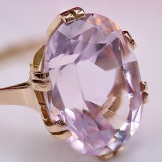 This is part of Chairish’s Fine Jewelry assortment.  Ring in 18 karat rose gold, eagle head hallmark.  A charming cocktail ring, its oval-shaped setting holds an oval kunzite with 6x2 claws.  The ring is flat.  Weight of the kunzite : 17.71 carats approximately.  Height : 20.5 mm approximately, width : 15.2 mm approximately, thickness : 10,2 mm approximately, ring width at base : 1.7 mm approximately.  Total weight of the jewel : 7,9 g approximately.  US Size : 6,5 ;   Antique jewel - French wor Vintage Cocktail Rings, Rose Gold Cocktail, Vintage Cocktail Ring, Gold Eagle, French Retro, Gold Cocktail Ring, Gold Cocktail, Eagle Head, Vintage London