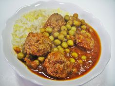 meatballs, rice and peas are on a plate