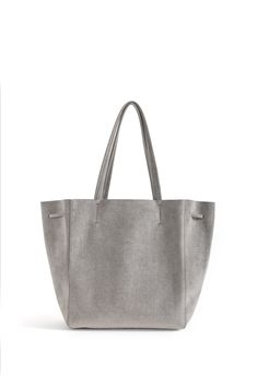 KWONN Shopper is made with vegan and sustainable performance fabric that's durable and easy to clean. The Shopper can be worn as a large shoulder bag or as a smaller size ​bucket bag by pulling the ​drawstring ​at the center of the bag. The exterior of the bag has a subtle shine coating, and the inner material features a softer texture with an uncanny suede feel. Each bag is handmade in New York by a master artisan. Fits up to 15" laptops. Ultra-lightweight, No lining, Hardware-free. Everlasting Luxury Large Capacity Bucket Bag For On-the-go, Luxury Bucket-shape Shoulder Bag For On-the-go, Chic Bucket-shaped Hobo Bag For On-the-go, Modern Travel Hobo Bag With Bucket Shape, Modern Travel Hobo Bag In Bucket Shape, Modern Large Capacity Bucket Bag For Shopping, Modern Bucket Bag With Rolled Handles For Shopping, Versatile Bucket Bag With Top Handle, Modern Bucket Bag Tote For Shopping