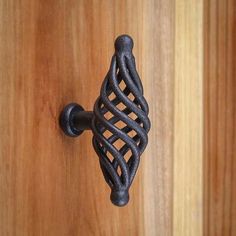 a close up of a door handle on a wooden door