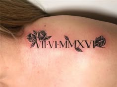 a woman with a tattoo on her neck has the word vivi - mmv in roman numerals