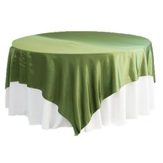 a green and white table cloth on top of a round table