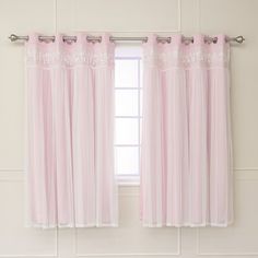 a pink curtain hanging on the side of a window