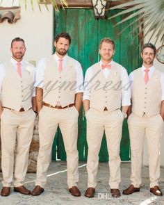 a group of men standing next to each other in front of a green wooden door