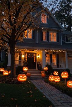 pumpkins lit up in front of a house