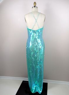 "This is a JAW-DROPPING vintage gown! It's fully embellished with iridescent sequins and in perfect condition! Measurements: Bust - 34\" Waist - 27\" Hips - 36\" Length - 59\" This item comes from a pet-free and smoke-free home. If you would like more info or have any questions, please don't hesitate to ask!" Prom Mermaid Dress With Sequins And Fitted Bodice, Sequin Mermaid Dress With Fitted Bodice For Evening, Sequined Mermaid Hem Evening Dress With Fitted Bodice, Sequined Evening Dress With Fitted Bodice And Mermaid Hem, Glamorous Mermaid Dress With Sequins And Fitted Bodice, Green Sequined Mermaid Dress For Prom, Glamorous Green Mermaid Gown, Sequined Mermaid Hem Gown For Night Out, Sequin Mermaid Hem Gown For Party Season