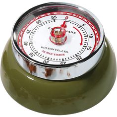 an army green clock with red hands and numbers on the face is sitting in front of a white background