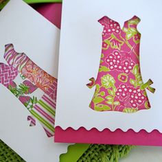 three cards with different designs on them and one has a dress in the middle,