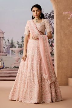 Indulge in the ethereal beauty of this delicate peach lehenga, expertly crafted with intricate hand embroidery using cutdana, sequins, and pearls. The exquisite pearldrop detailing adds a touch of whimsy, elevating the overall elegance of the piece. Perfect for any special occasion, this lehenga promises to make you feel enchanting and radiant as you celebrate in style. Peach Lengha, Peach Lehenga, Embroidered Lehenga, Silk Organza, Ethereal Beauty, Indian Design, Every Woman, Lehenga, Hand Embroidery