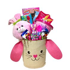 a basket filled with stuffed animals and candy