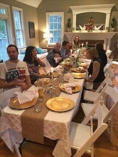 a group of people sitting around a dinner table