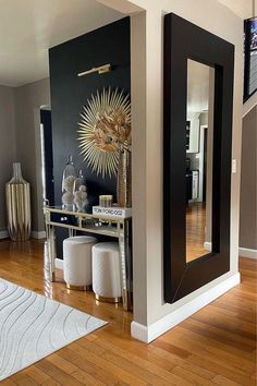 a living room filled with furniture and mirrors