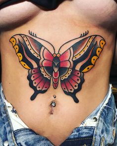 a woman's stomach with a colorful butterfly tattoo on her belly and bottom part