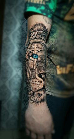 a man's arm with a tattoo on it that has a lion and blue eyes