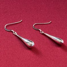 Gorgeous Handmade Pair of Teardrop Liquid Long Dangle Drop Earrings. Perfectly sleek and sophisticated which makes these earring perfect for any occasion, a gift that we are sure will be adored by any loved one. UK Sterling Silver 925 Hallmarked on the arm of the french hook fastening. We've Rhodium plated the earrings to ensure they are less likely to tarnish, Rhodium is actually a form of Platinum. Metal: UK Sterling Silver ( Hallmarked ) Rhodium Plated to help prevent tarnishing. Info: Nickel Free Stone: N/A Quantity: A Pair Will Be Provided. Total Earring Length: 1 inch approximately. Widest width: 8mm at the base of the drop. Type: Minimalist / Sleek / Occasion / Prom / Party / Evening Wear / Everyday. Fastening: Silver French Hooks, Hallmarked Silver 925. Shape: Pear / Teardrop / Wat Pierced Drop Earrings, Formal Teardrop Drop Earrings With French Hook, Classic Teardrop Dangle Earrings With French Hook, Nickel Free Elegant Long Drop Earrings, Classic Long Drop Teardrop Earrings As Gift, Classic Long Drop Teardrop Earrings For Gift, Classic Dangle Teardrop Pierced Earrings, Formal Hypoallergenic Long Drop Teardrop Earrings, Hypoallergenic Long Drop Teardrop Earrings For Formal Occasions