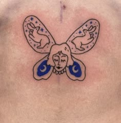 a man's chest with an image of a flying bird and stars on it