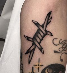 a tattoo on the arm of a person with a knife in it's hand