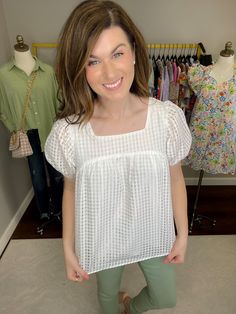 It doesn't get more chic than a white top for spring/summer. This timeless silhouette gets a modern edge with the gorgeous addition of windowpane fabric. It's a perfect option for pairing with your colored or blue denim. The puff sleeves and square neckline make this top a stand out! Also coming in hot pink. Top is lined through the body.Top measures 25" in length. Bust measures 20" from underarm seam to seam. Measurements taken on a small. Add 1" to each measurement as you go up in size. Fabric Spring Cotton Puff Sleeve Top With Square Neck, Cotton Puff Sleeve Top With Square Neck For Brunch, Spring Puff Sleeve Top With Square Neck, Spring Brunch Puff Sleeve Top With Square Neck, Spring Brunch Square Neck Puff Sleeve Top, Modern Square Neck Tops For Summer, Modern Puff Sleeve Blouse For Spring, Modern Square Neck Top For Summer, Chic Square Neck Puff Sleeve Top For Spring