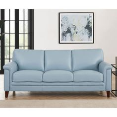 a light blue leather couch in a living room