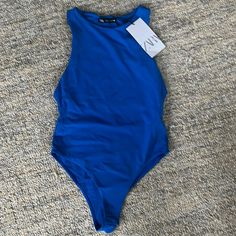 Nwt Zara Blue Halter Neck Bodysuit. Seamless Fabric. Never Worn. Blue Sleeveless Bodysuit For Swimming, Blue Fitted Bodysuit For Beachwear, Chic Stretch Swimwear By Zara, Zara Stretch One-piece Bodysuit, Blue Sleeveless Bodysuit For Pool, Blue Summer Bodysuit For Parties, Chic Blue Stretch Bodysuit, Blue Sleeveless Bodysuit For Spring, Blue Bodysuit For Summer Parties