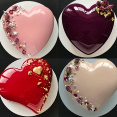 four heart shaped plates with different designs on them