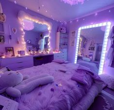 a bedroom with purple lighting and stuffed animals on the bed