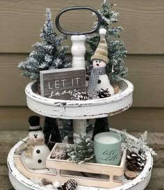 two tiered trays with snowmen and pine cones