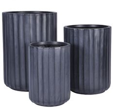 three black vases sitting next to each other