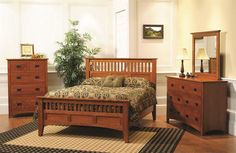 a bedroom scene with focus on the bed and dresser