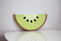 Add a splash of fun to your accessories with our cute kiwi zipper pouch! This adorable and vibrant pouch is perfect for storing your small essentials in style. Whether you're heading to school, work, or a casual outing, this kiwi-themed pouch is sure to bring a smile to your face. Key Features: Charming Kiwi Design: Features a delightful kiwi fruit design that adds a playful touch to your daily essentials. High-Quality Material: Made from durable and lightweight fabric that ensures long-lasting use. Convenient Zipper Closure: Easy-to-use zipper closure keeps your items secure and easily accessible. Compact and Portable: Perfect size to fit in your handbag, backpack, or tote, making it ideal for on-the-go use. Versatile Storage: Great for holding coins, keys, makeup, stationery, and other s Cute Green Zipper Pouch Pencil Case, Trendy Green Pouch Pencil Case, Trendy Green Pencil Case Pouch, Kiwi Design, Kiwi Fruit, Fruit Design, Coin Purses, Purse Pouch, Daily Essentials