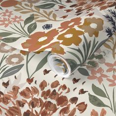 an image of a floral wallpaper with brown and orange flowers on white background, as well as a roll of tape