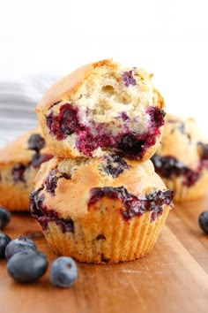 two blueberry muffins stacked on top of each other