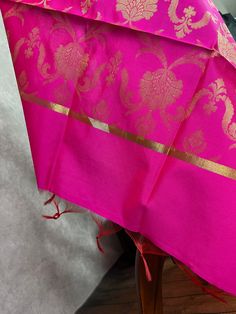 Beautiful Hot Pink Color Dupatta with Floral Jaal design Perfect Gift !! Very Light Weight Note - Dupatta has red tassels at the end. Item: DupattaBase color : Hot PinkFabric : Silk (Not Pure Silk)Work : Zari Weaved with tasselsLength of the Dupatta : 88 inches approx.Width of the dupatta : 35 inches (Approx.)Store Policies- No return or exchange will be accepted for color variations.- No return or exchange will be accepted if the color does not match your other clothing or your partners or anyo Cheap Zari Work Dupatta For Puja, Luxury Dola Silk Dupatta With Border, Luxury Slub Silk Dupatta With Printed Border, Luxury Bollywood Handloom Dupatta, Luxury Dupatta With Printed Border For Traditional Ceremonies, Luxury Zari Weaving Dupatta For Festivals, Luxury Handloom Dupatta For Ceremonial Occasions, Luxury Ceremonial Slub Silk Dupatta, Luxury Gold Dupatta With Zari Weaving