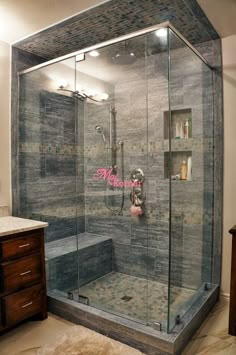 a walk in shower sitting inside of a bathroom