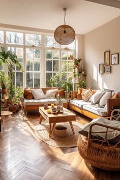 a living room filled with lots of furniture and plants on the windows sills