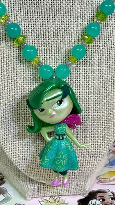 This Beautiful Character Necklace is a perfect gift for any Child or Adult alike.  ⭐️We use High Quality Stretchy Cord & Beads that connects with the Beaded Tube and cover by a Crimp Bead . This Beautiful Necklace can be stretched enough to put over your little one's head.  ☀️If you would like a Toggle or Lobster Clasp we can do it at no extra charge we would use High Quality String Bead Wire which won't be stretchy. Just add it to the Notes!  🌳If no note it will have the Stretchy Cord when you Novelty Green Necklace For Gifts, Green Novelty Necklace For Gift, Unique Green Necklace For Gift, Fun Green Necklaces For Gifts, Fun Green Necklaces For Gift, Playful Green Necklaces For Gift, Fun Green Necklace For Gift, Playful Green Necklace For Gifts, Playful Green Necklace For Gift