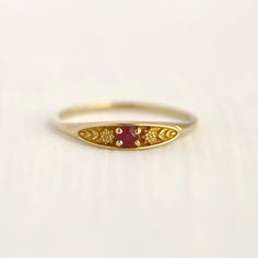 July birth ring This ring will be a very meaningful piece for those born in July. July's birthstone and birth flower are Ruby and Lotus. Sweet ruby and delicately carved lotus will shine and bloom forever. This dainty and slim signet ring is comfortable to wear all the time. This piece will be perfect gift for both to others and yourself. * Detail * Material : 14K solid gold, 18K solid gold, 925 sterling silver Color : Yellow gold, White gold or Rose gold(925 sterling silver is excluded) Stone : Birth Ring, Lotus Ring, Ruby Ring Gold, Ring Ruby, Ring Birthstone, July Birthstone, Birth Flowers, Ruby Ring, Birthstone Ring