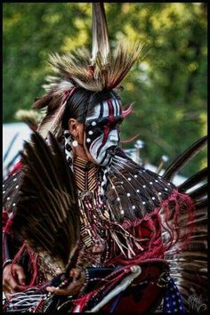 a native american woman with feathers on her head