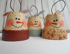 three handmade snowmen sitting next to each other