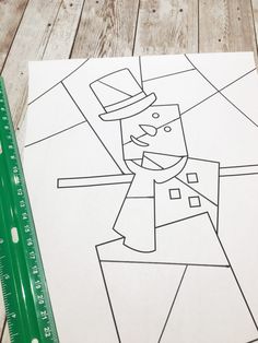 a paper cut out of a man with a top hat and cane standing in front of a ruler