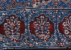 an intricately designed blue and red cloth