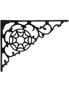 an ornate iron shelf bracket on a white background