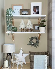 the shelves are decorated with christmas decorations and photos on them, along with other items