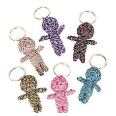 four keychains with different colors and designs on them, one is made from rope