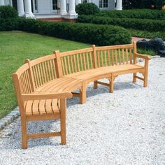 a wooden bench sitting on top of a gravel field