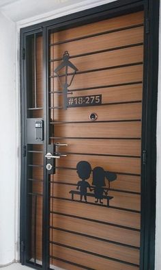 an image of a door that has been painted with the silhouettes of two people