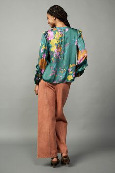 This floral-print blouse offers a welcome punch of color and pattern to the season's ensembles. Detailed with a clean placket and ruffle trim at the shoulders and sleeves, the V-neck top will become an instant favorite. •Split neckline with placket •Long sleeves •Elasticized cuffs •Ruffle trim •Relaxed fit •Relaxed Fit DIMENSIONS •Standard: 24.75" Length Item number 2230399-1100% Polyester Green V-neck Top With Ruffles, Green Long Sleeve Tops With Floral Print, Green V-neck Tops With Blouson Sleeves, Green V-neck Blouse With Blouson Sleeves, Green Blouse With Blouson Sleeves For Spring, Green Ruffle Sleeve Top With Floral Print, Green Top With Ruffle Sleeves And Floral Print, Chic Floral Print Blouse With Ruffle Sleeves, Chic Ruffle Sleeve Blouse With Floral Print