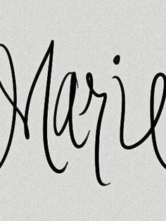 the word marie written in cursive writing on a white paper with black ink