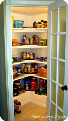 an open pantry door with food in it